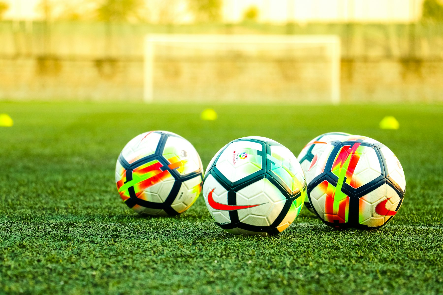Classic footballs on a pitch